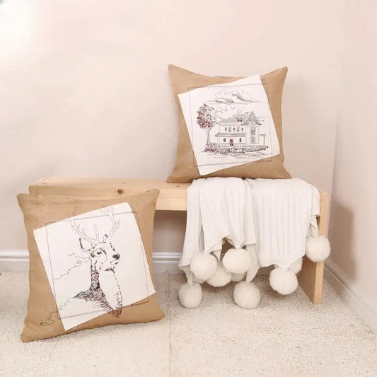 Rustic tan burlap pillow cover with black and white embroidered fashion pillow designs of deer and house panels