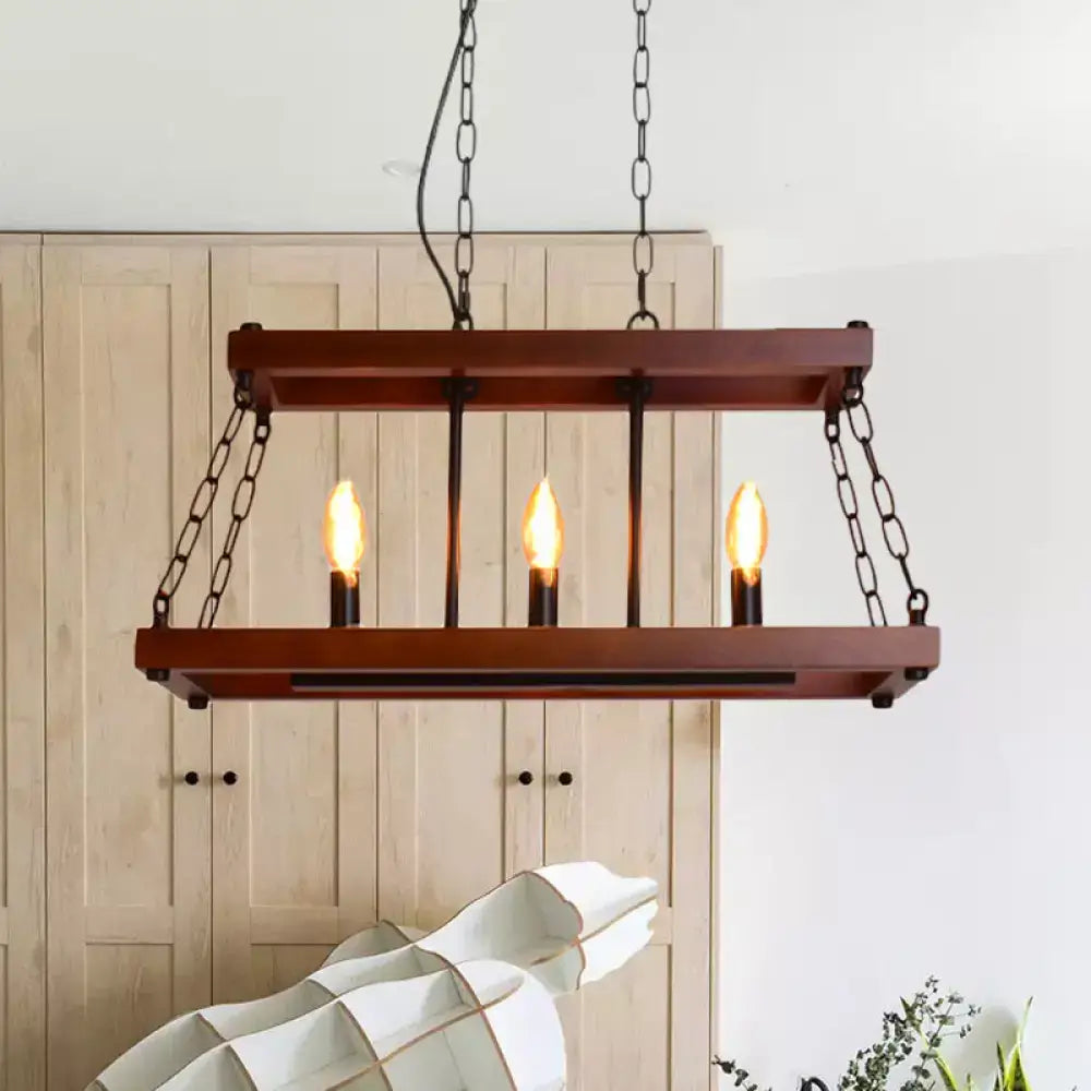 Rustic vintage brown wood chandelier with three exposed candle-style bulbs and black metal chains for dining room island lighting