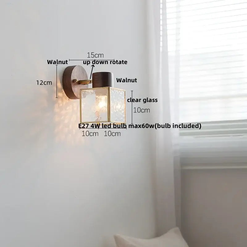 Rustic walnut wood wall sconce with clear glass square shade and brass accents for bedroom lighting fixture