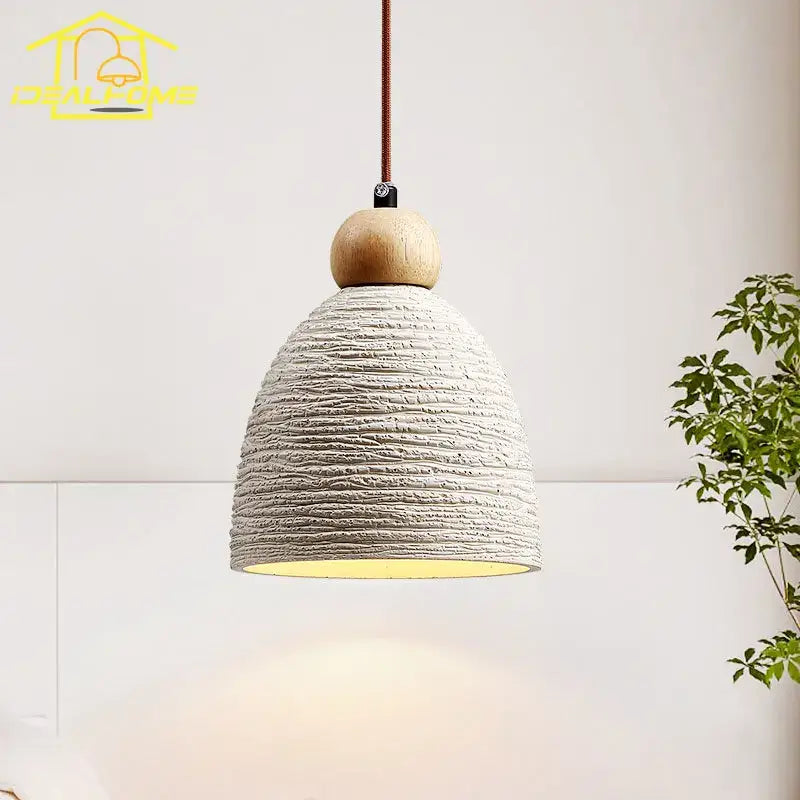 Rustic white concrete cement pendant light with natural wood sphere and warm yellow glow for dining room decorbites pendant lights
