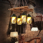 Rustic wooden chandelier with four warm yellow shades, clear glass, white fabric, and metal arm suspended by chains