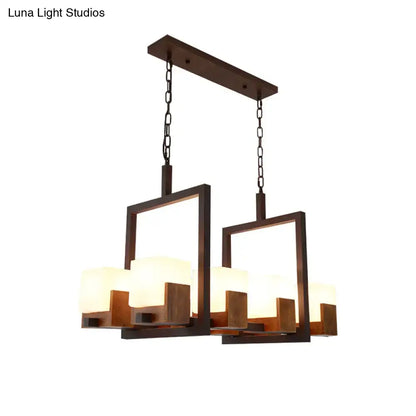Modern rectangular restaurant island light with dark bronze frame, wooden accents, and rustic white glass shades for wine glasses