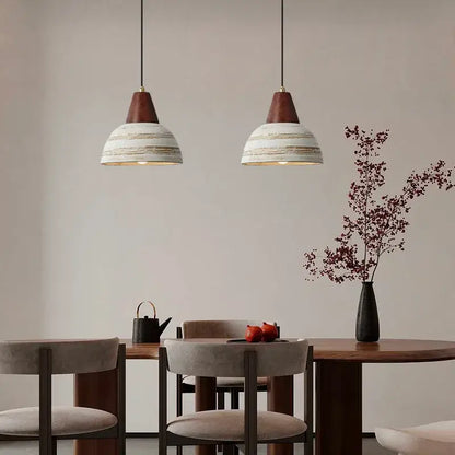 Two rustic white ceramic wood pendant lights with distressed shades hanging from black cords for kitchen decorbites ceramic wood led lighting