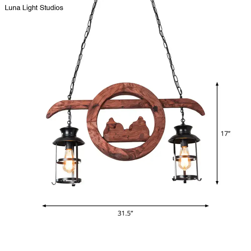 Rustic farmhouse brown lantern pendant lamp with clear glass black metal lanterns and circular cutout wood arms