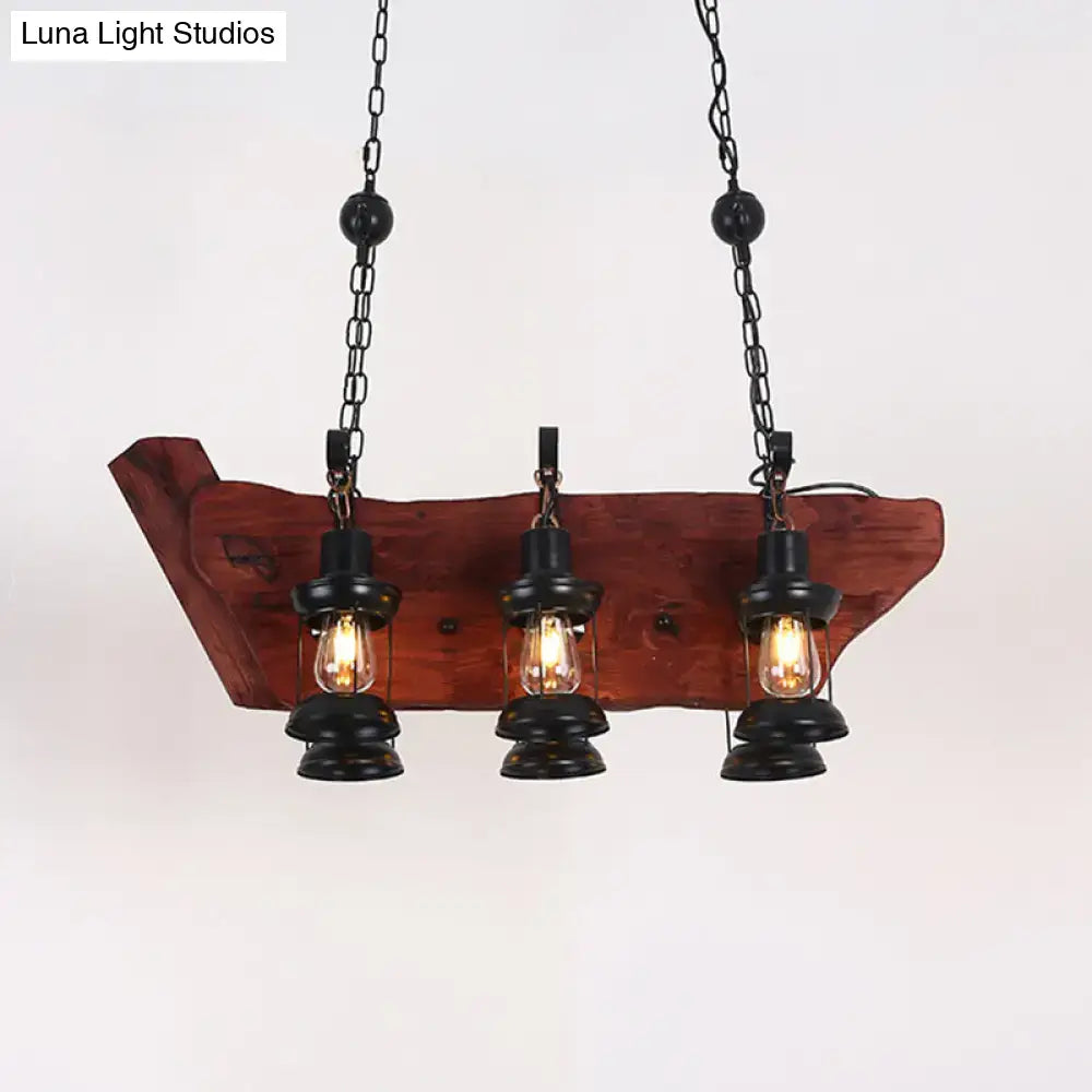 Rustic farmhouse brown lantern pendant lamp with three black lantern-style bulbs and wooden plank design hanging from chains