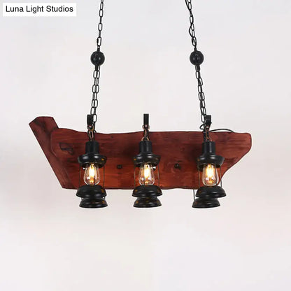 Rustic farmhouse brown lantern pendant lamp with three black lantern-style bulbs and wooden plank design hanging from chains