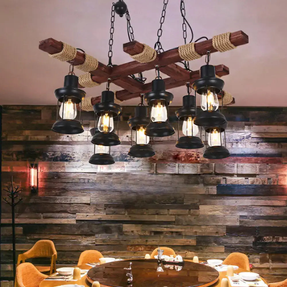 Rustic wooden chandelier with black metal lantern pendant lamps and rope-wrapped beams for farmhouse decor