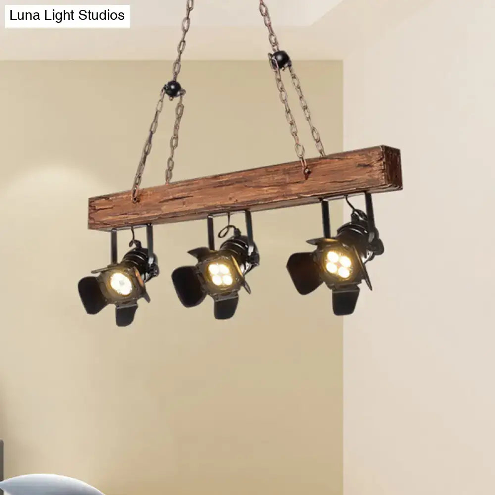 Industrial-style rustic wood and black metal 3 light island pendant kitchen light with three black spotlight bulbs hanging