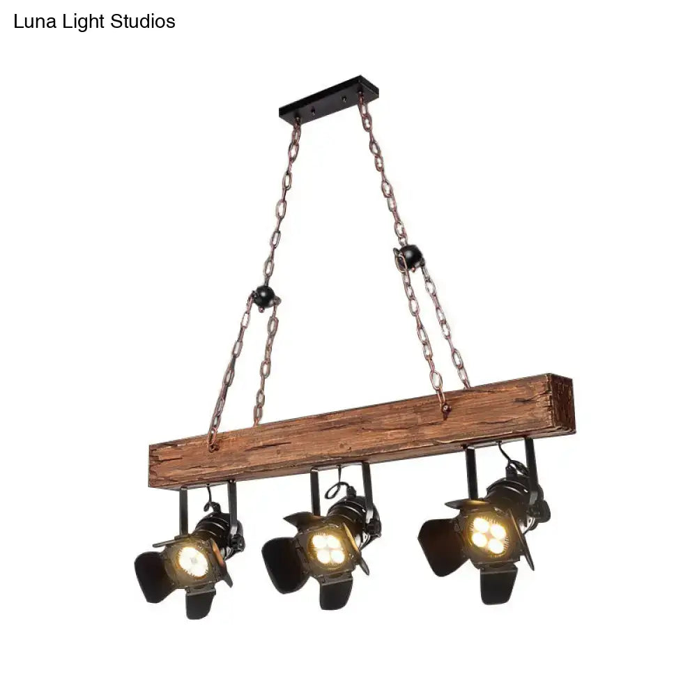Rustic wood and black metal 3 light island pendant kitchen light with industrial style wooden beam and black spotlights suspended by chains