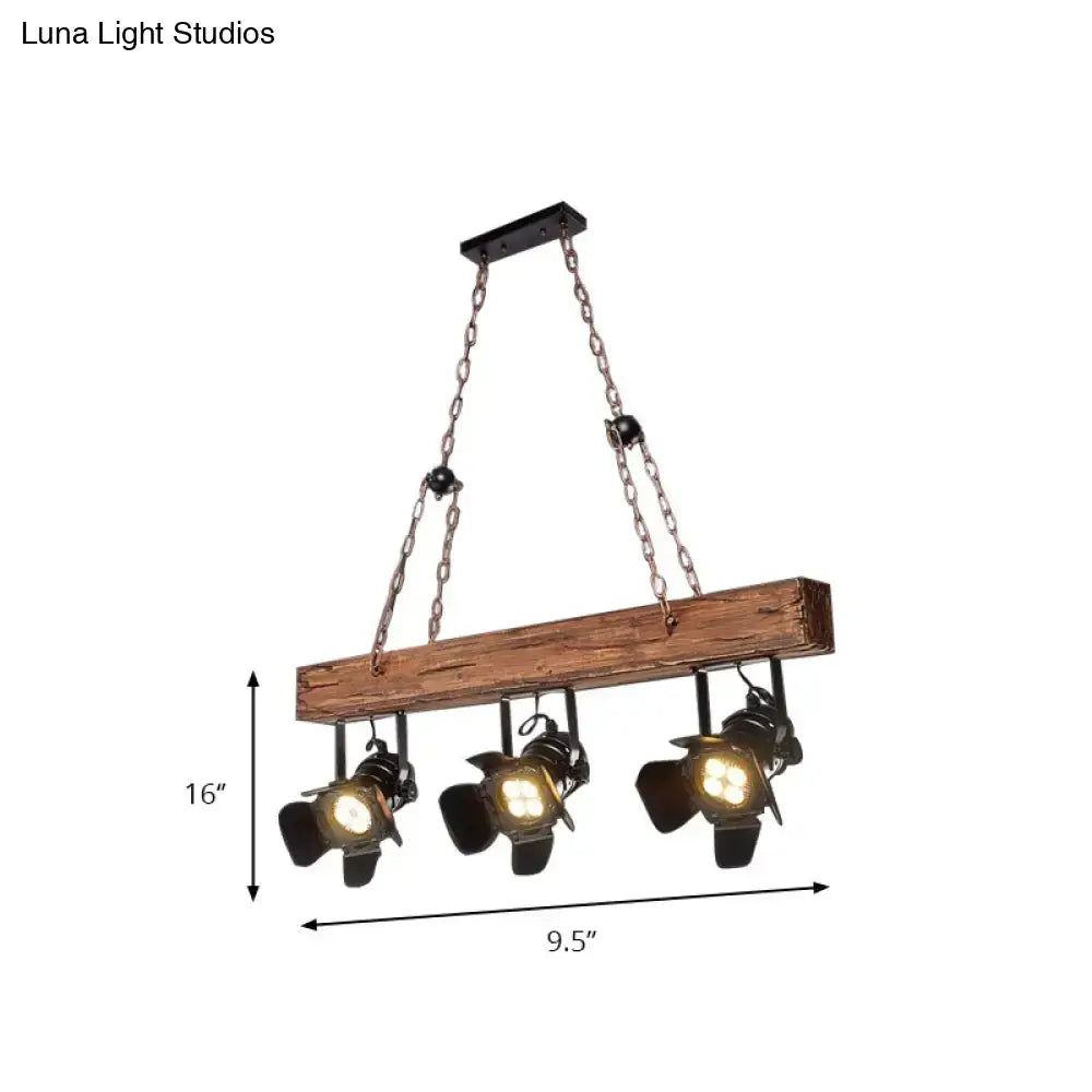 Rustic wood and black metal 3 light island pendant kitchen light with industrial-style wooden beam and three black spotlights suspended by chains
