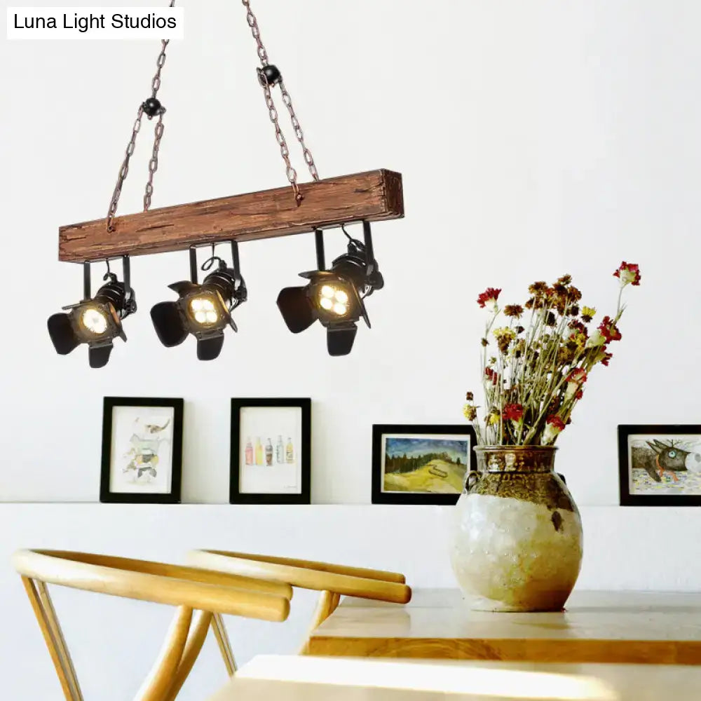 Rustic wood and black metal 3 light island pendant kitchen light with wooden beam and three black industrial spotlights