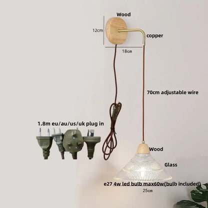 Rustic wood and brass wall light with natural wood base, copper arm, clear glass shade, and pull chain switch
