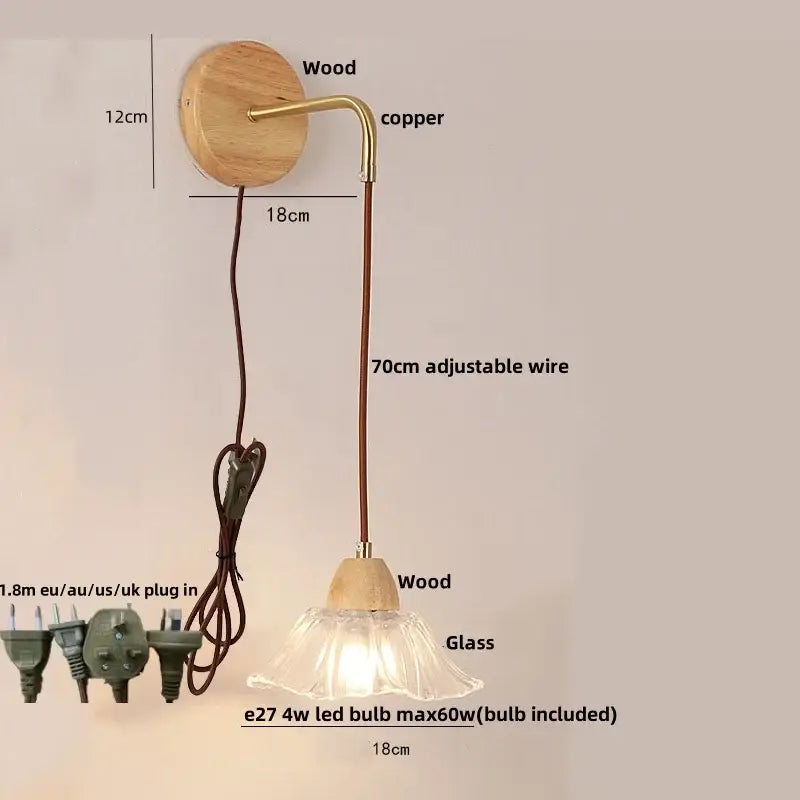 Rustic wood and brass wall light with clear glass bell shade and pull chain switch featuring 70cm adjustable cord