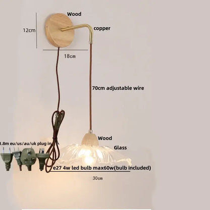 Rustic wood and brass wall light with clear glass shade and copper accents featuring a pull chain switch