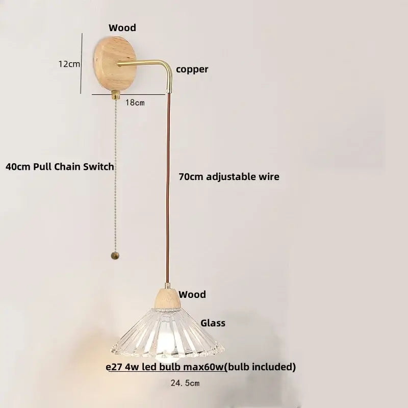 Rustic wood and brass wall light with clear glass pendant and pull chain switch featuring fluted faceted design