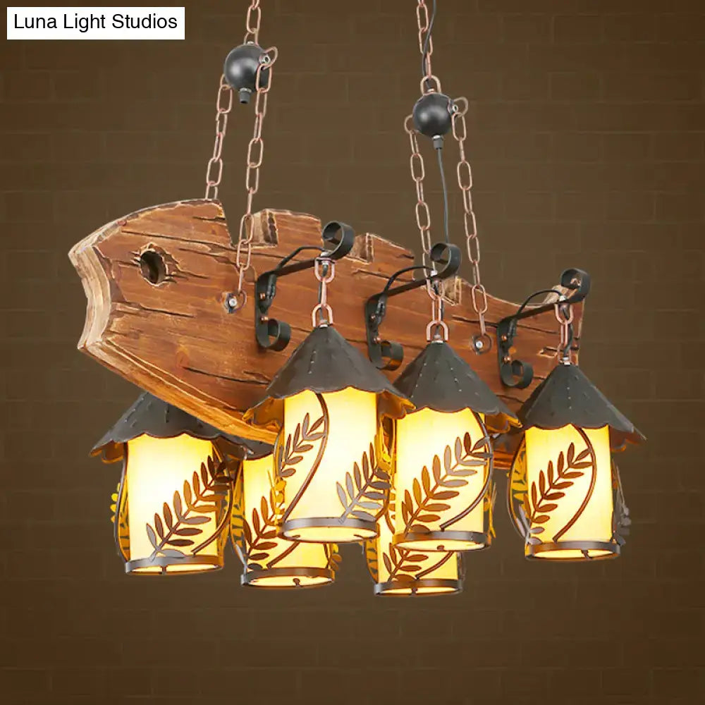 Rustic wood and glass dining room chandelier island lamp with three illuminated glass shades leaf cutouts and metal arms