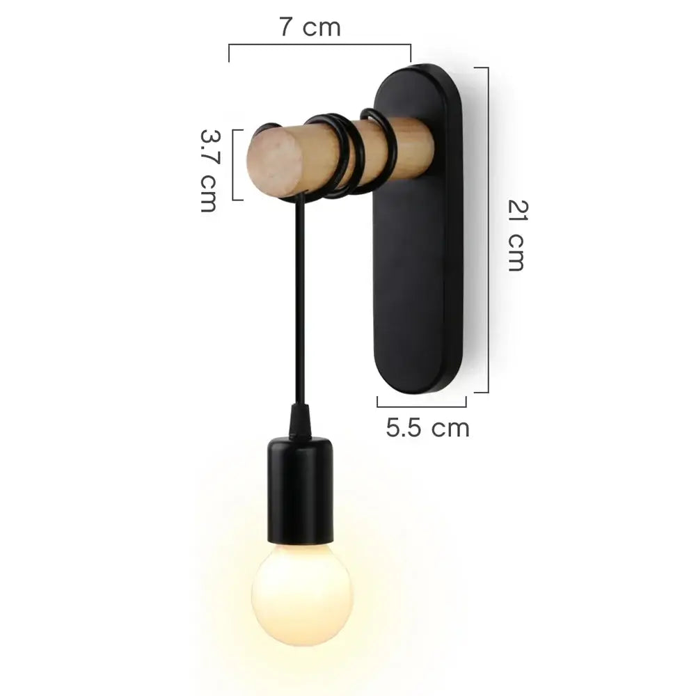 Rustic wood and iron wall sconce with black cylindrical fixture and exposed bulb by decorbites loft american iron