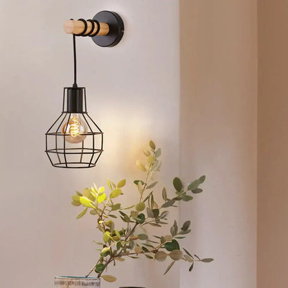 Rustic wood and iron wall sconce with black metal cage and exposed filament bulb for decorbites loft american iron decor