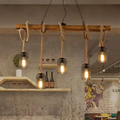 Rustic wooden beam chandelier with thick natural rope suspending five black metal mesh pendant light cages
