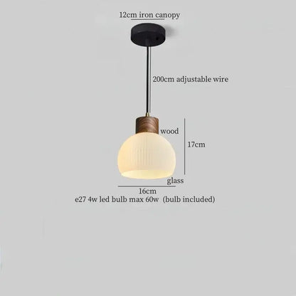 Rustic wood and ribbed glass led pendant light with black iron canopy and adjustable wire for dining room use