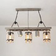 Rustic wooden ceiling light with three glass shades and concrete fixtures suspended by black metal chains