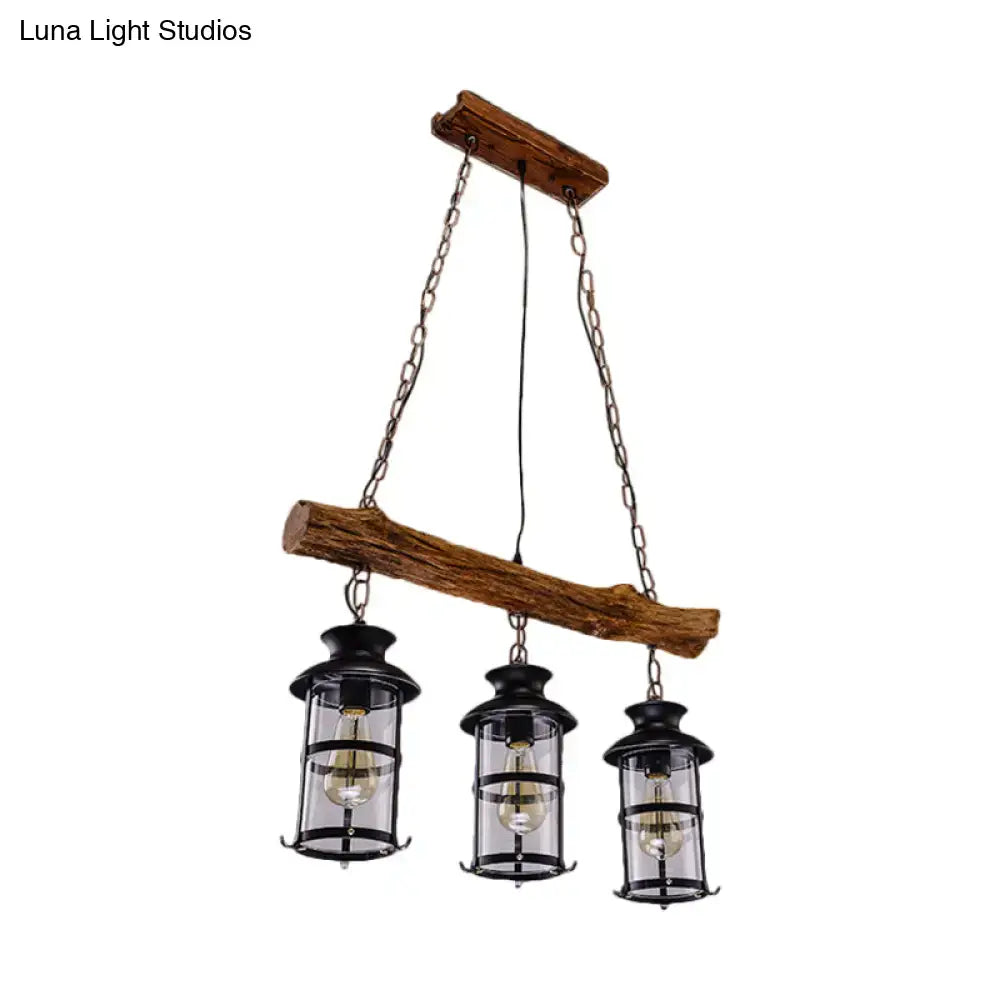 DecorBites™ nautical clear glass cluster pendant with wood design features three black lantern-style fixtures in brown