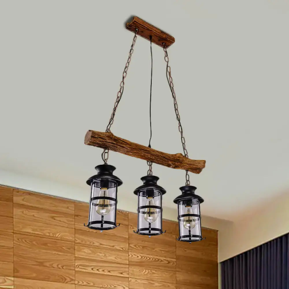 Decorbites™ nautical clear glass cluster pendant with wood design features three black lantern-style bulbs with clear glass panels