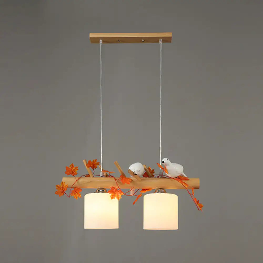 DecorBites™ modern wood linear island lighting with warm glass shades, natural wood, maple leaf plant decor for restaurants