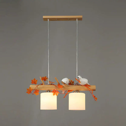 DecorBites™ modern wood linear island lighting with warm glass shades, natural wood, maple leaf plant decor for restaurants
