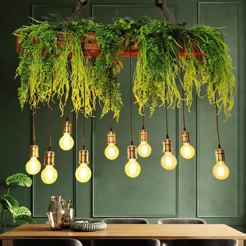 A rustic wooden planter with lush green fern deco hanging from the ceiling paired with e26 e27 fixture height bulbs