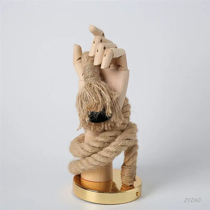 A beige wooden hand shape hemp rope wall light with natural grain and thick tan rope knot for restaurant corridor