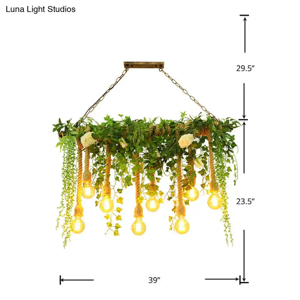Rustic wooden island light fixture with warm edison bulbs, braided rope, decorative vines, and white flowers for dining room