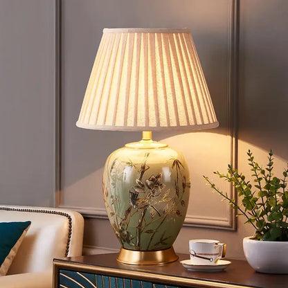 Sage green american style ceramic table lamp with gold-leaf bamboo motifs and off-white pleated fabric shade decorbites american style