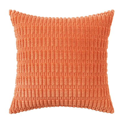 Coral-colored corduroy throw pillow with a textured ribbed pattern paired with sage green corduroy velvet pillowcase set
