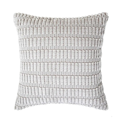 A soft light gray textured throw pillow with woven ribbed pattern in a sage green corduroy velvet pillowcase set