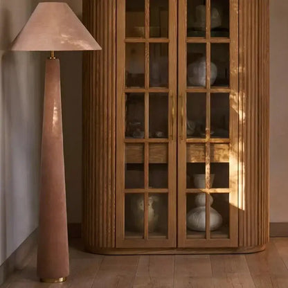 Tall slender floor lamp with a soft pink cotton velvet shade and gold-toned base for living room decorbites cotton velvet