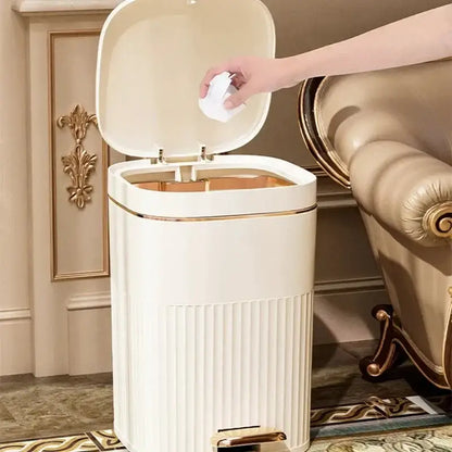 Cream-colored rectangular pedal trash can with ribbed texture and gold-tone accents from decorbites light luxury collection