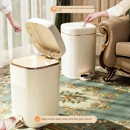 Cream-colored rectangular pedal trash can with gold trim and ridges for hands-free use by decorbites light luxury