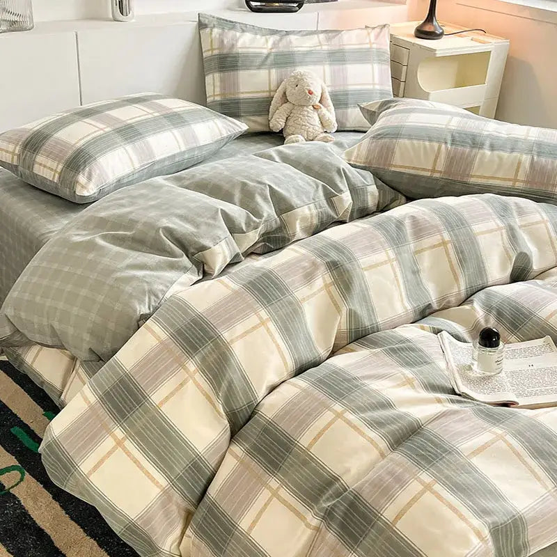 Sage green grid print cotton bedding set featuring a plaid comforter in soft sage green cream and beige tones