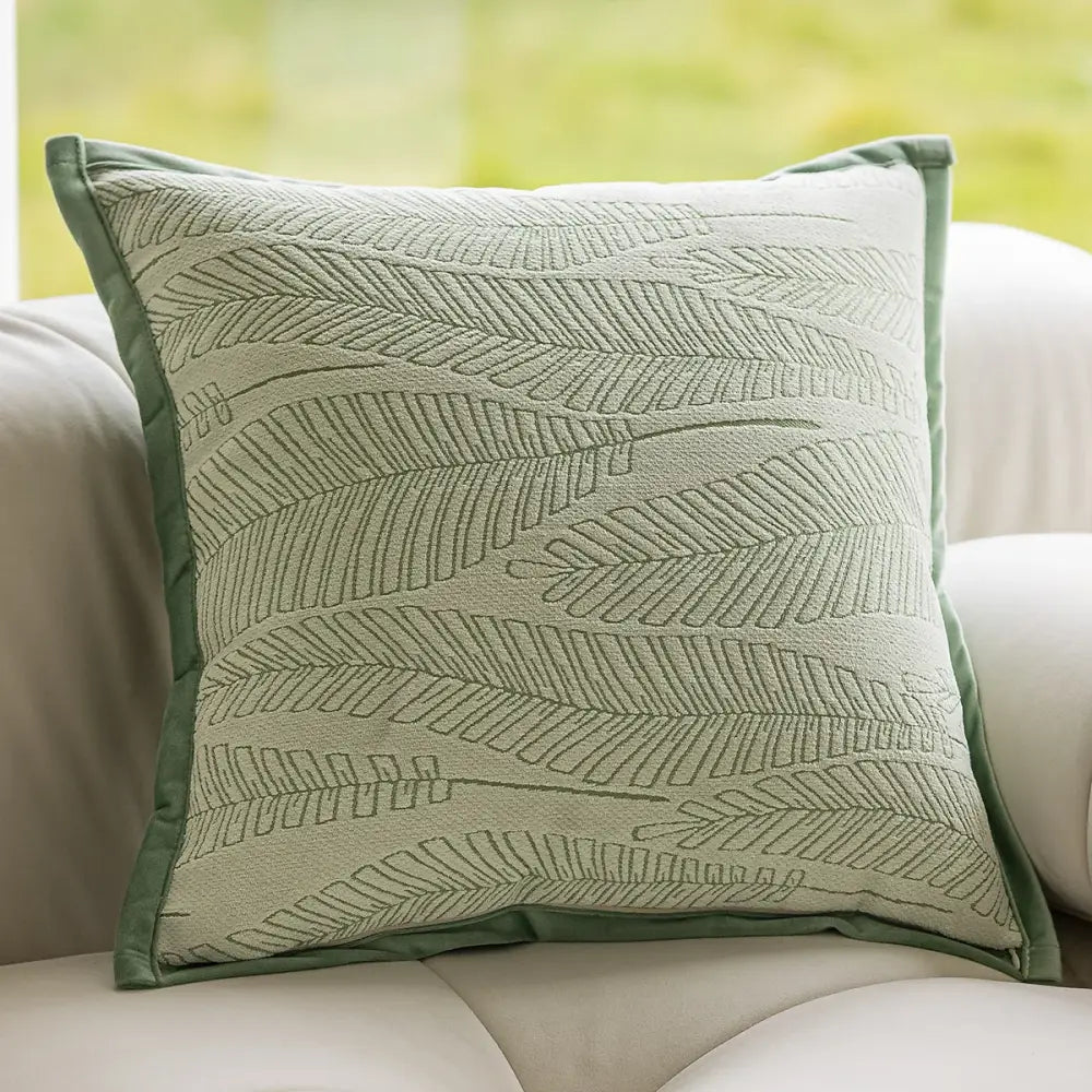 Square sage green plant jacquard pillow cover with subtle embroidered leaf pattern and matching piping for decorbites decorbites green plant