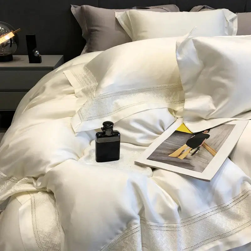 Cream-colored satin bedding set with delicate embroidered trim made from decorbites 1000tc lyocell fibre