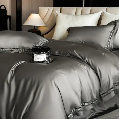 Silver satin duvet cover set with elegant beaded trim complementing cream and gold lace eucalyptus bedding