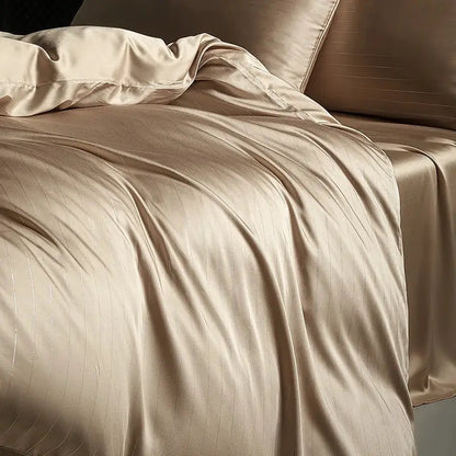 Beige satin duvet cover with subtle vertical ribbing in a dark gray and silver pinstripe bedding set