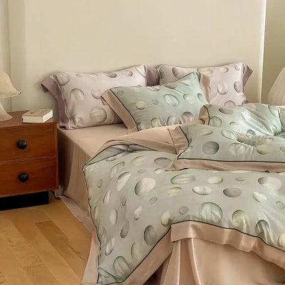 Pastel green and blush pink satin egyptian cotton bedding set with subtle circular dot pattern for bedroom use