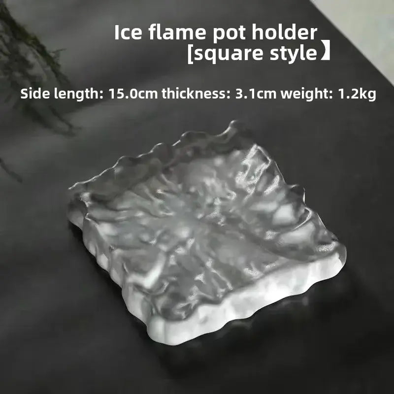 Clear square-shaped scalloped crystal glass coaster with textured frosty surface used as minimalist jewelry display panel