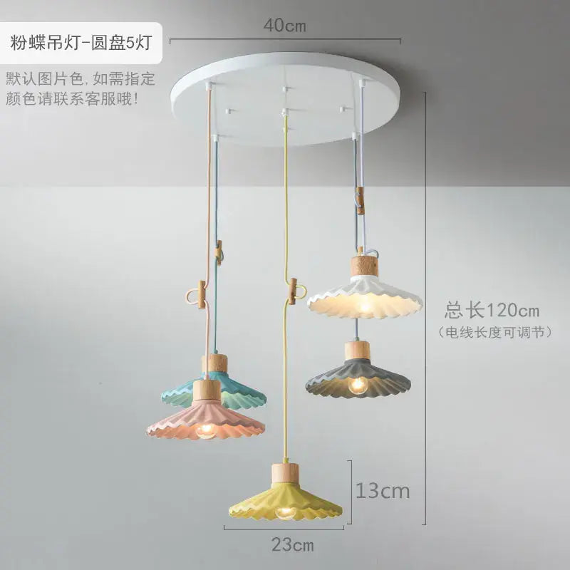 Scalloped pastel led pendant lights shaped like butterflies with wooden accents and adjustable cords for dining room