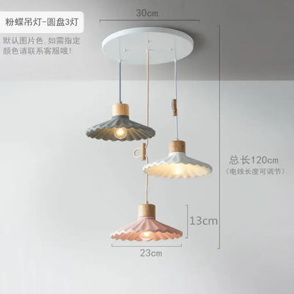 Scalloped pastel led pendant lights with butterfly shapes, wooden accents, and adjustable cords for dining room lighting
