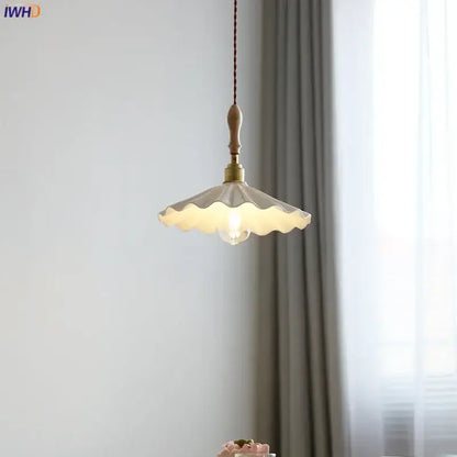 Scalloped cream ceramic led pendant light with wooden handle and brass fittings for dining room decorbites ceramic led