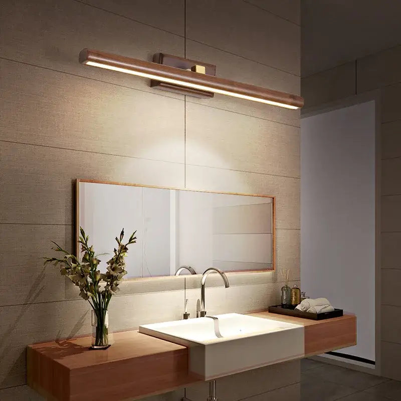 Modern wooden-finished led bathroom light fixture with sleek rectangular black walnut mirror lamp by decorbites emitting warm glow