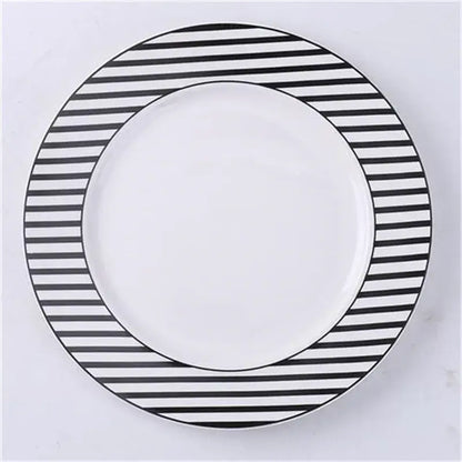 A round white ceramic dessert plate with a bold black and white striped border from decorbites ceramic dessert plates